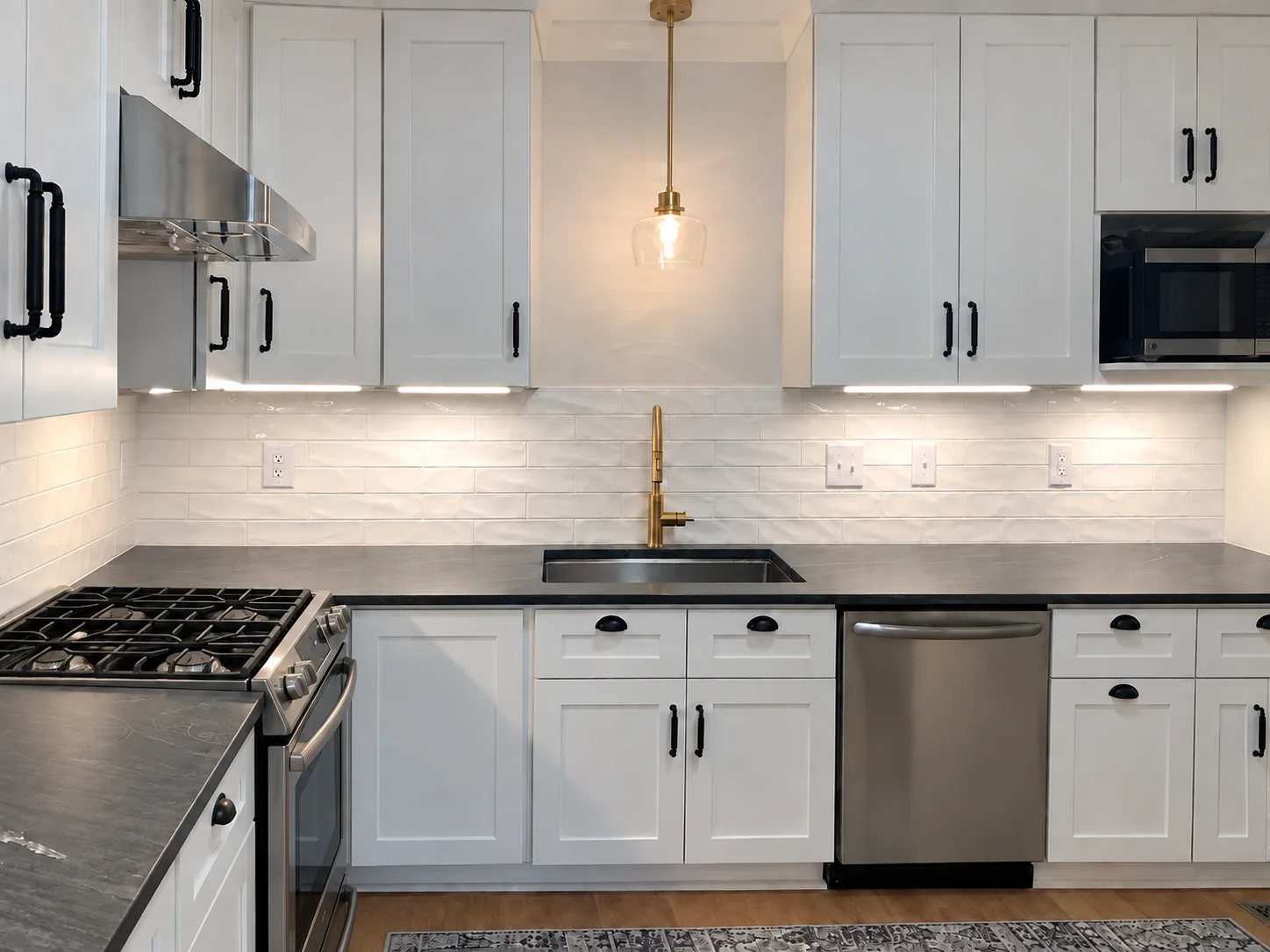 Clean-line kitchen with crisp cabinetry, layered lighting, and durable surfaces