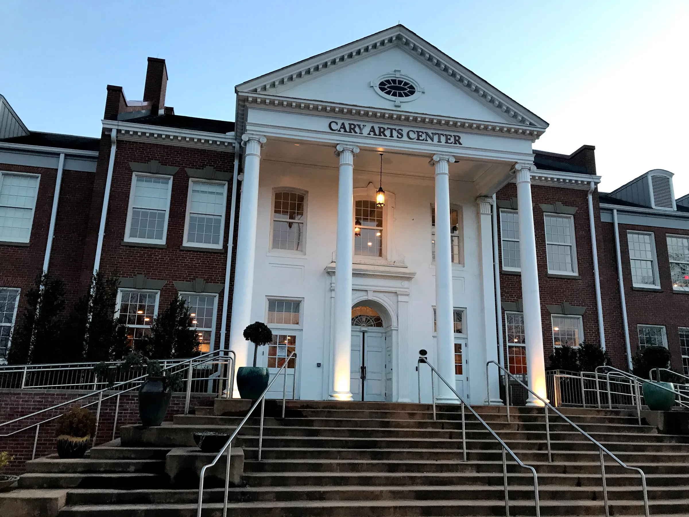 Brick facade and arched entrance of the Cary Arts Center