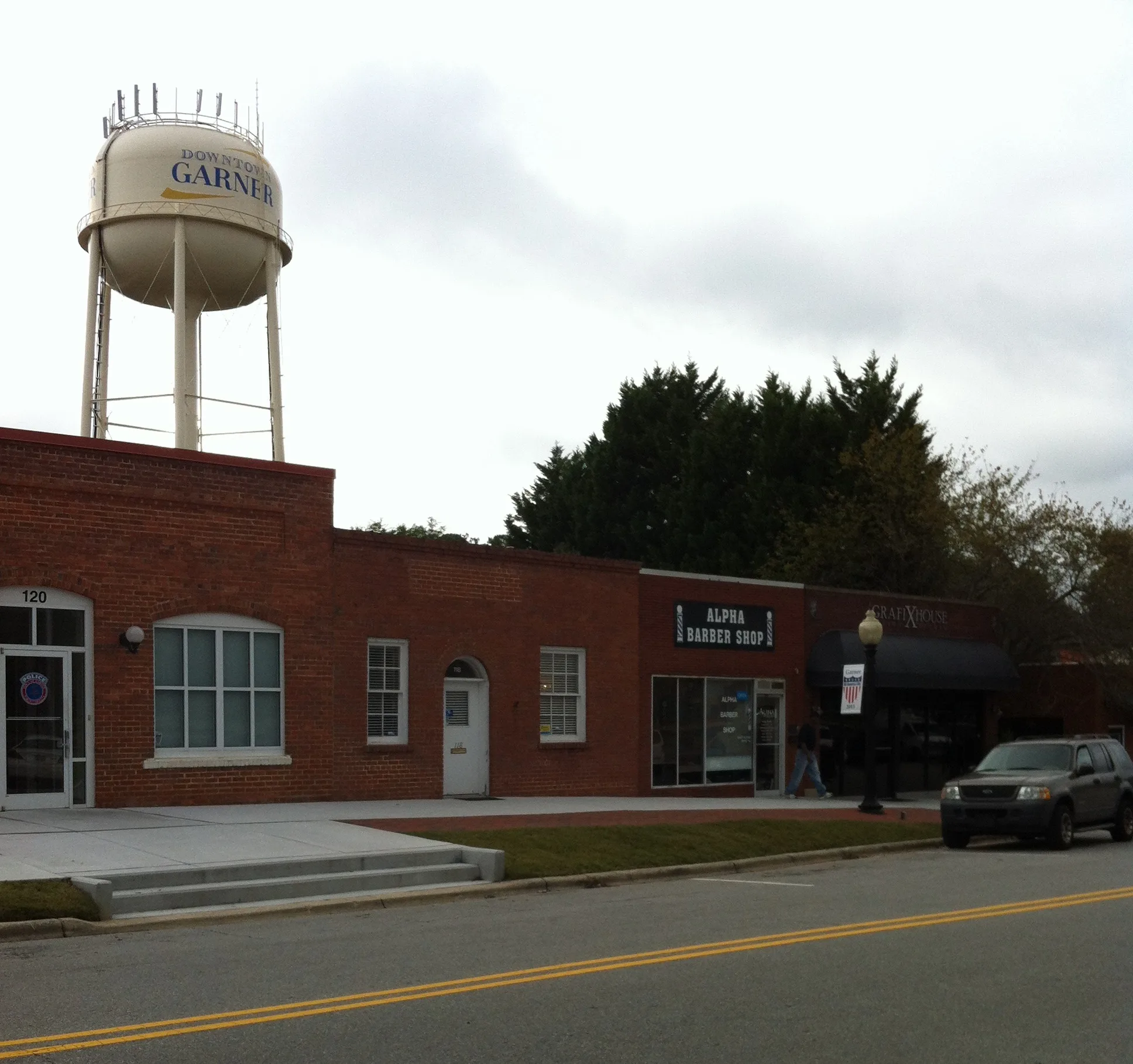 Garner water tower rising above trees in the historic district